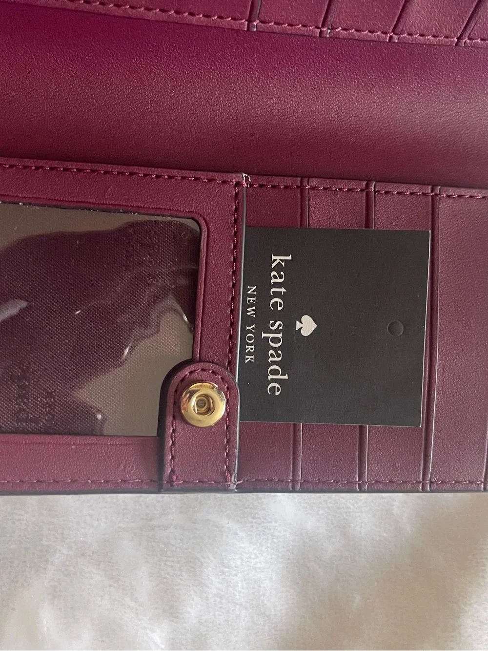 kate spade light pink saffiano leather wallet with gold logo